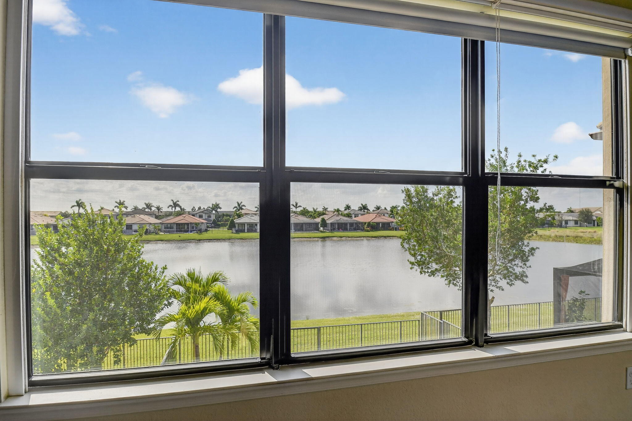 8301 Rearing Lane Lake Worth, FL 33467 - Photo 26 of 109 a view of a lake from a window