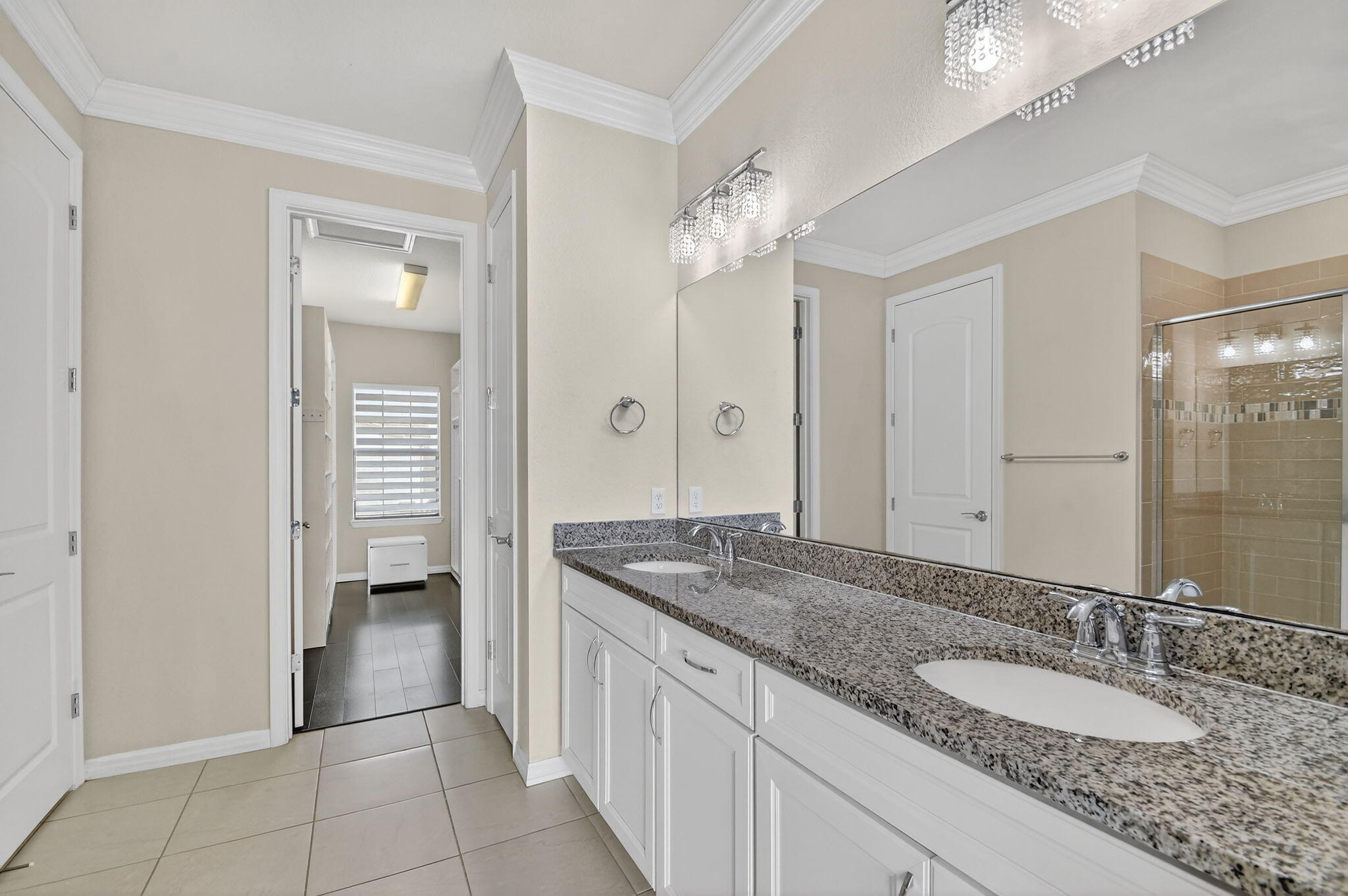 8301 Rearing Lane Lake Worth, FL 33467 - Photo 29 of 109 a bathroom with a granite countertop sink a mirror and a shower
