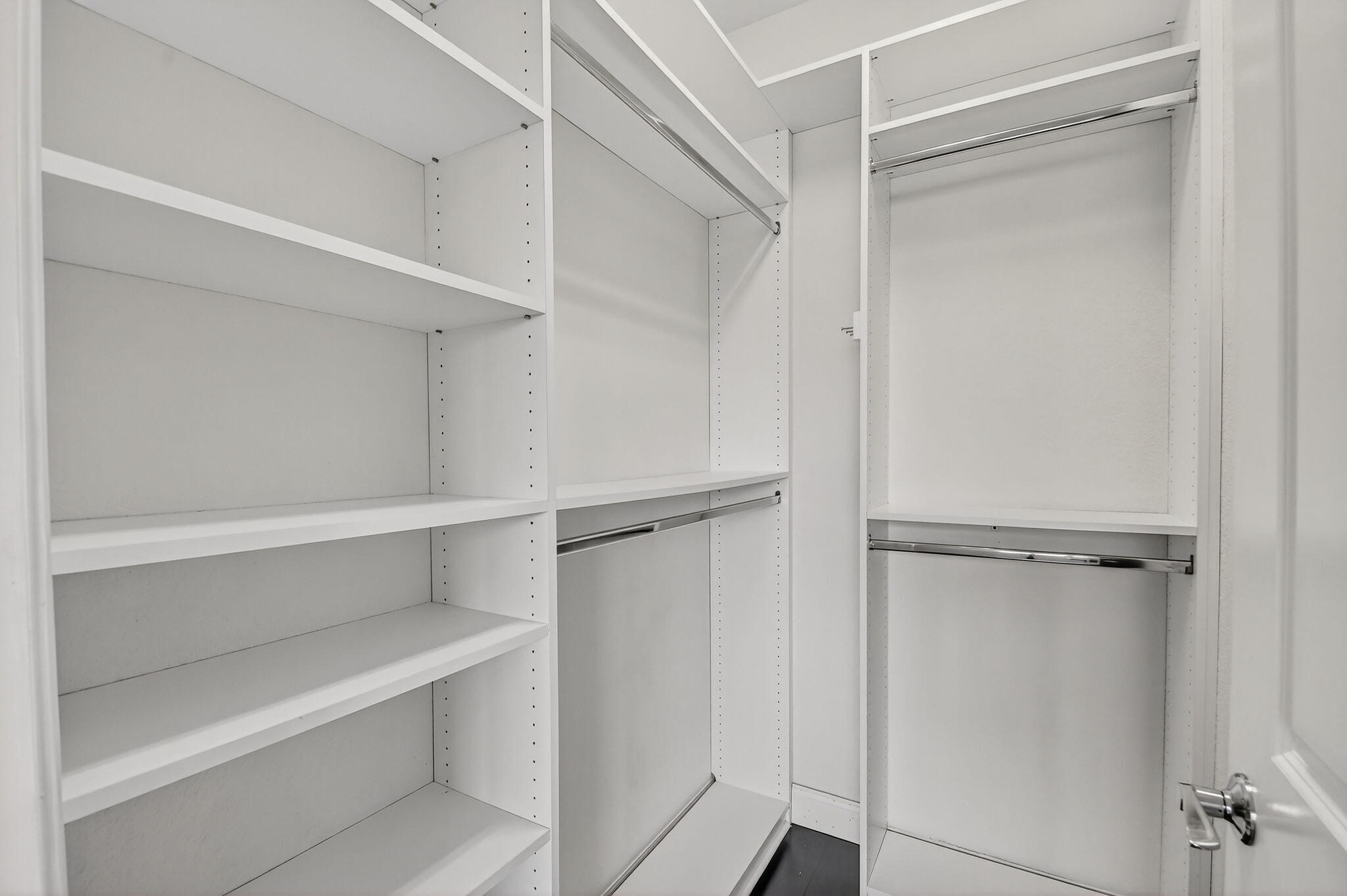 8301 Rearing Lane Lake Worth, FL 33467 - Photo 33 of 109 a view of walk in closet with empty racks