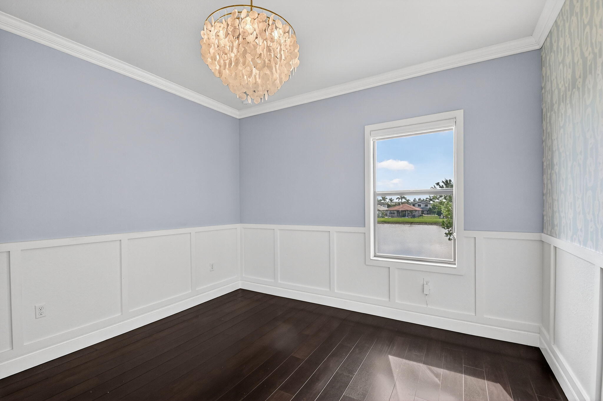 8301 Rearing Lane Lake Worth, FL 33467 - Photo 34 of 109 an empty room with wooden floor cabinet and windows