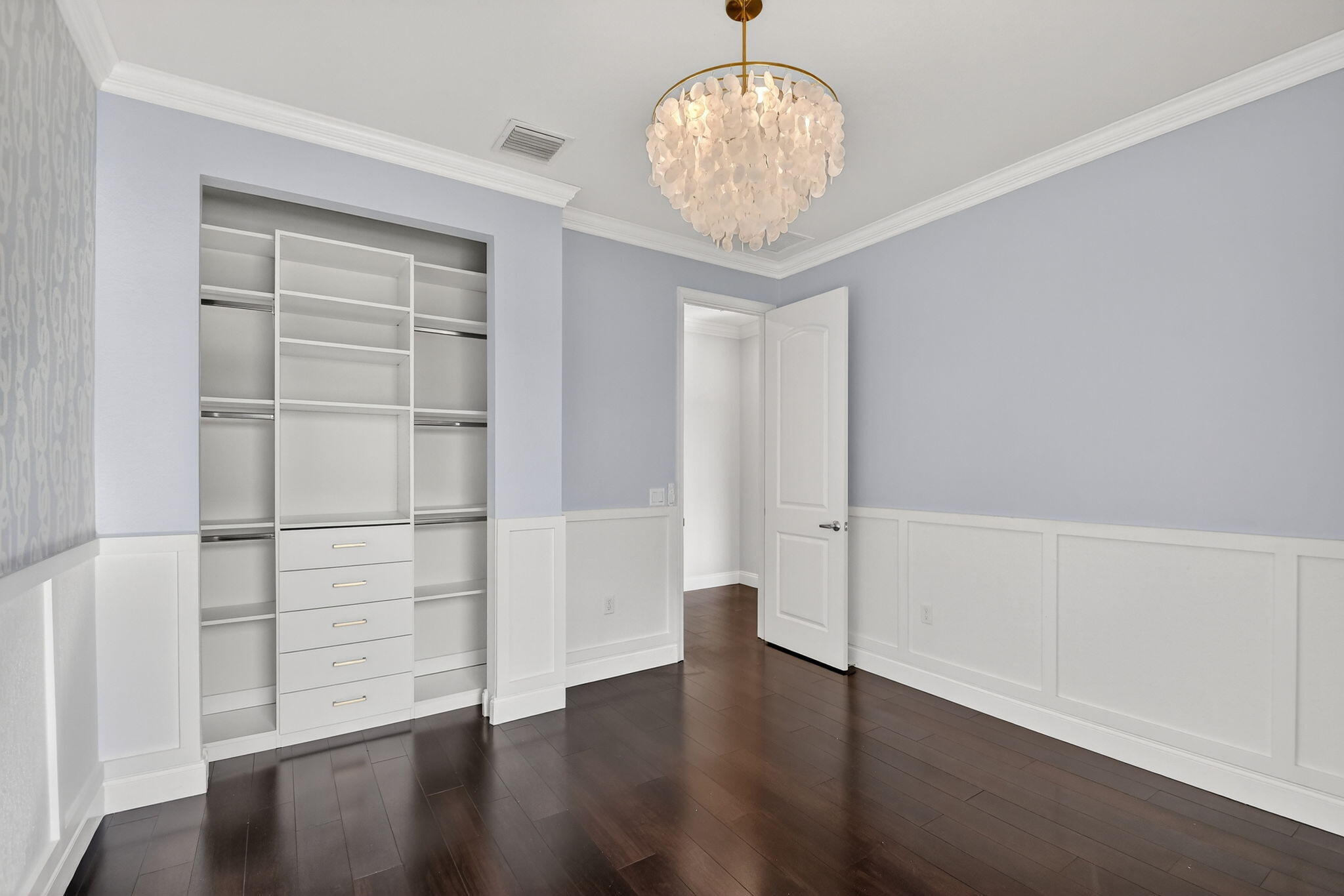 8301 Rearing Lane Lake Worth, FL 33467 - Photo 35 of 109 an empty room with wooden floor chandelier and windows