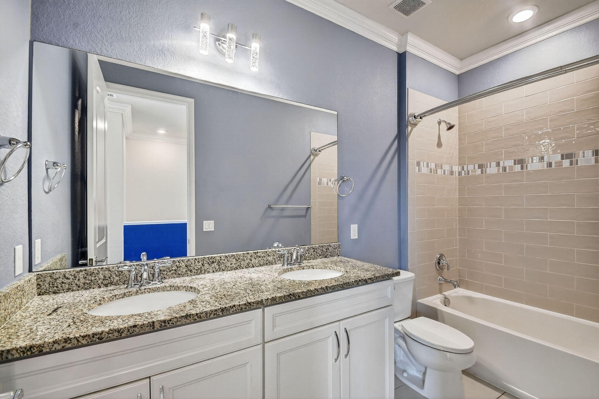 8301 Rearing Lane Lake Worth, FL 33467 - Photo 36 of 109 a bathroom with a granite countertop sink a toilet and a bathtub