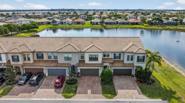 an aerial view of a house with a lake view