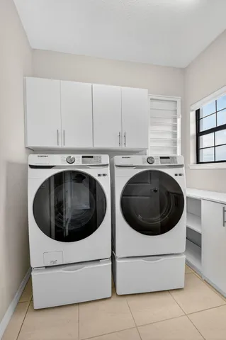 an aerial view of a house with garden space and street view
