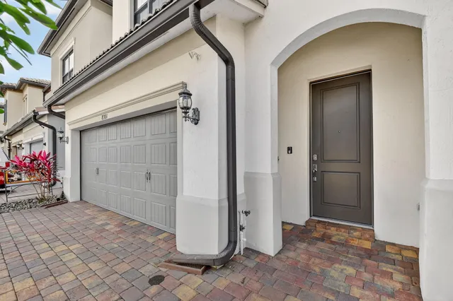 a view of staircase with white walls and a window