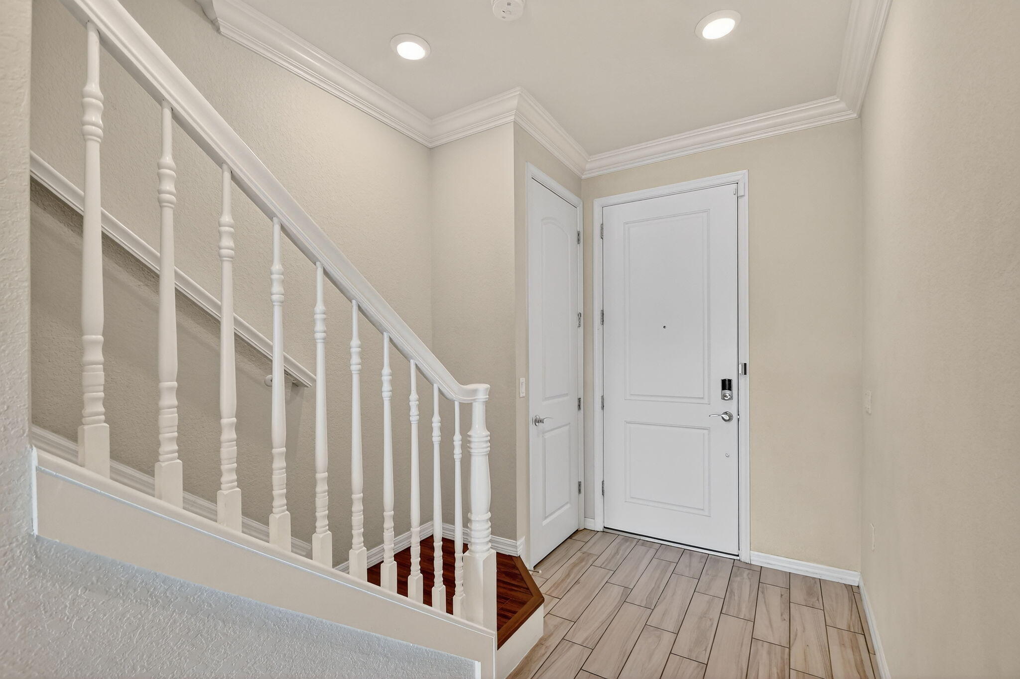 8301 Rearing Lane Lake Worth, FL 33467 - Photo 7 of 109 a view of staircase with white walls and a window