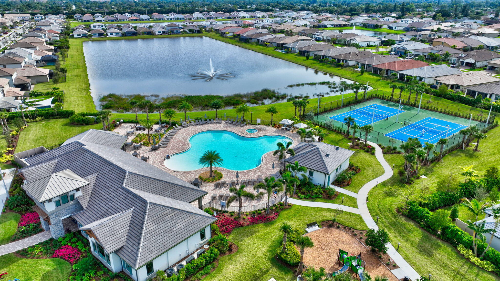 8301 Rearing Lane Lake Worth, FL 33467 - Photo 100 of 109 an aerial view of residential houses with outdoor space and swimming pool
