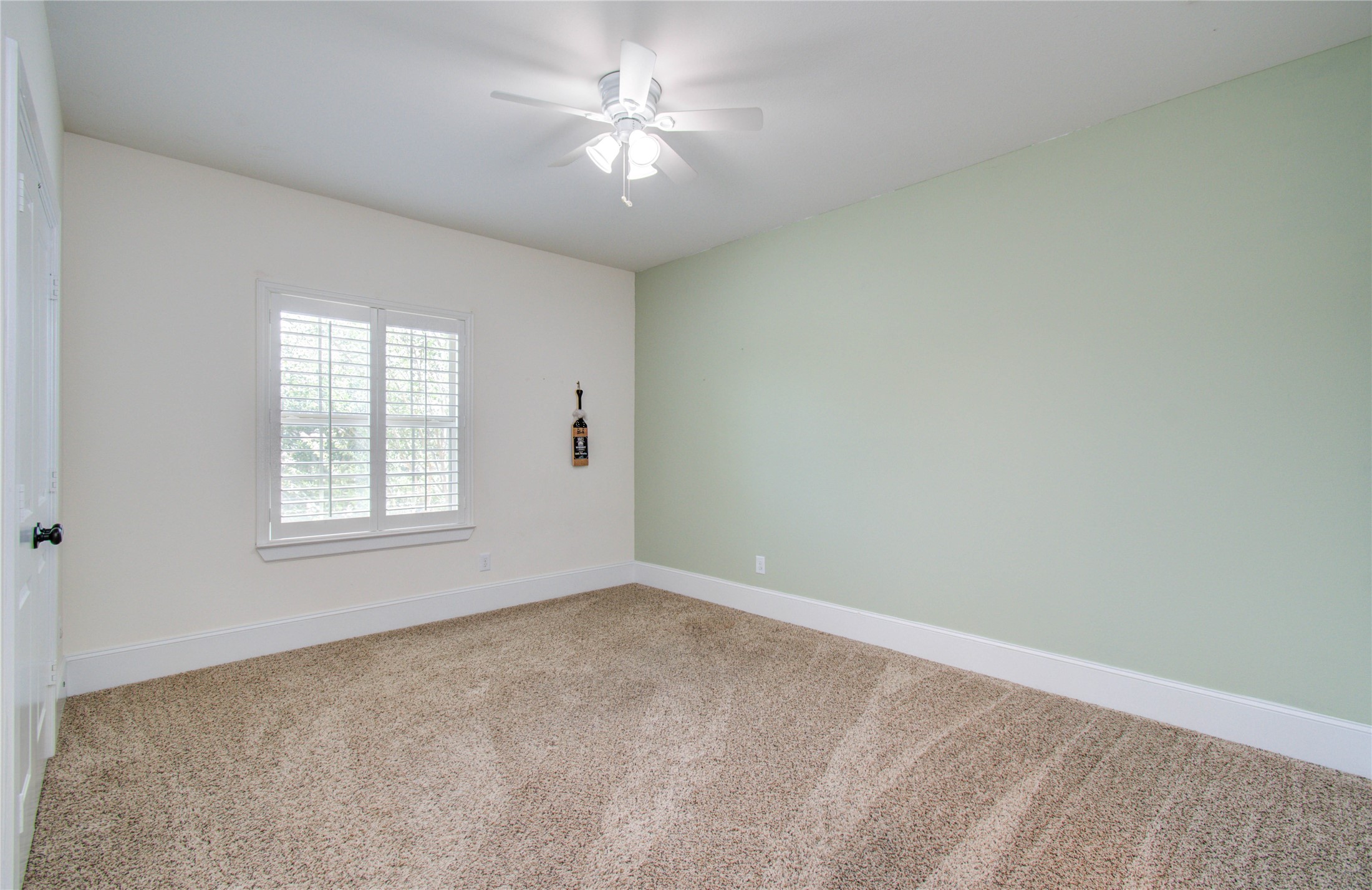 28627 Rolling Ridge Drive Katy, TX 77494 - Photo 35 of 44 en empty room with windows and ceiling fan
