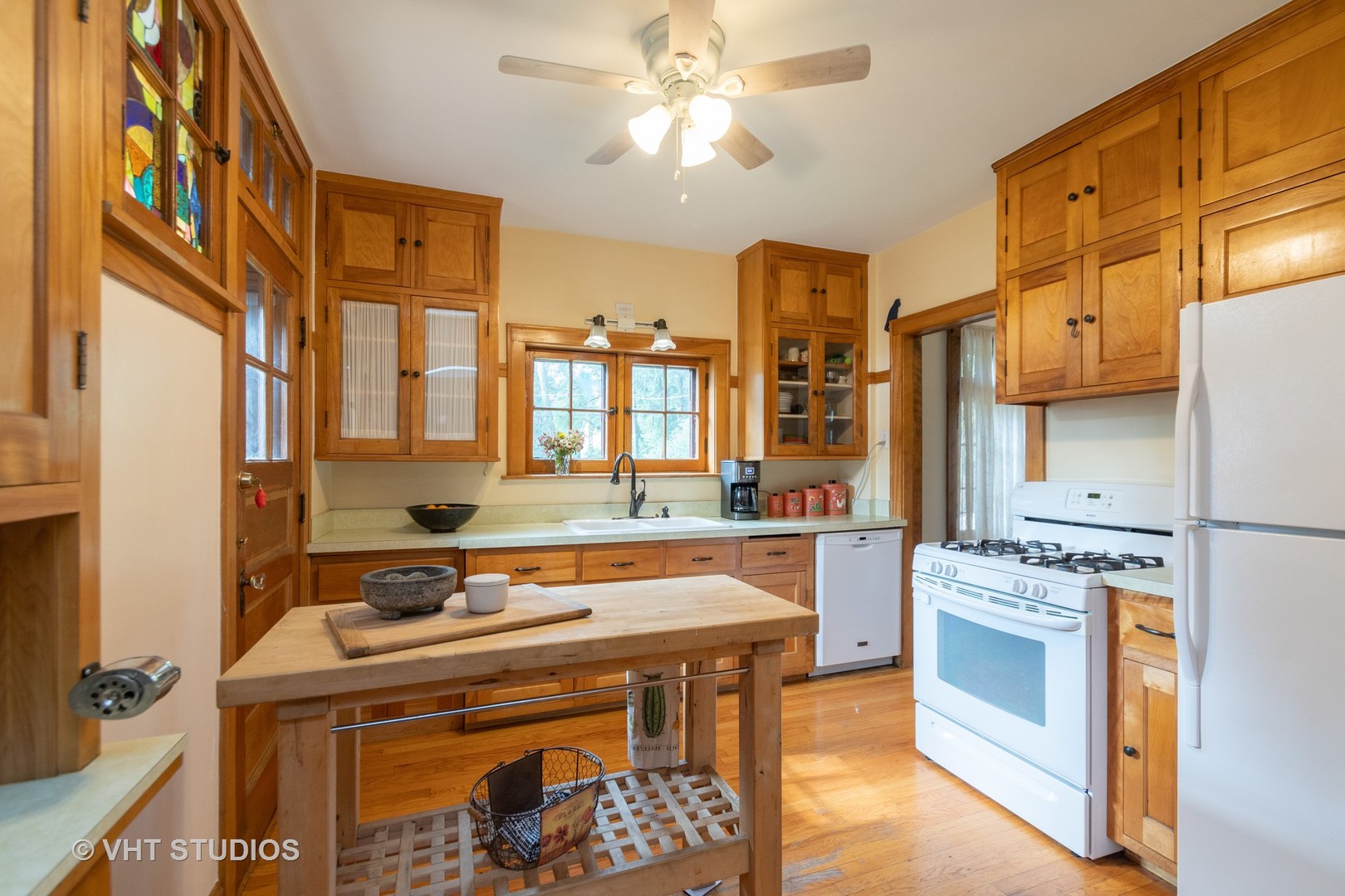 2321 Hawthorne Road Homewood, IL 60430 - Photo 4 of 11 a kitchen with a stove a sink and a refrigerator