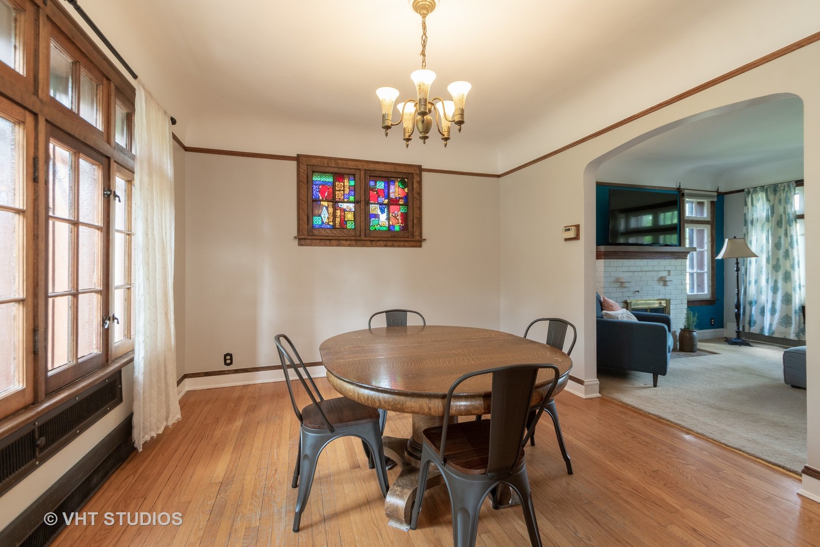 2321 Hawthorne Road Homewood, IL 60430 - Photo 5 of 11 a dining room with furniture a chandelier and wooden floor