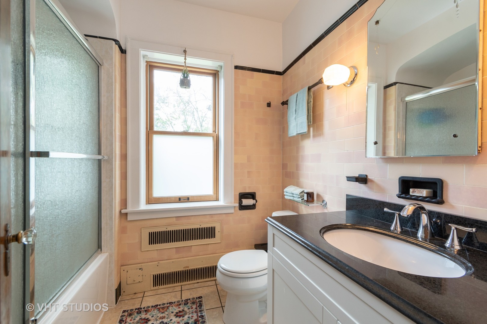 2321 Hawthorne Road Homewood, IL 60430 - Photo 9 of 11 a bathroom with a granite countertop toilet a sink and a mirror