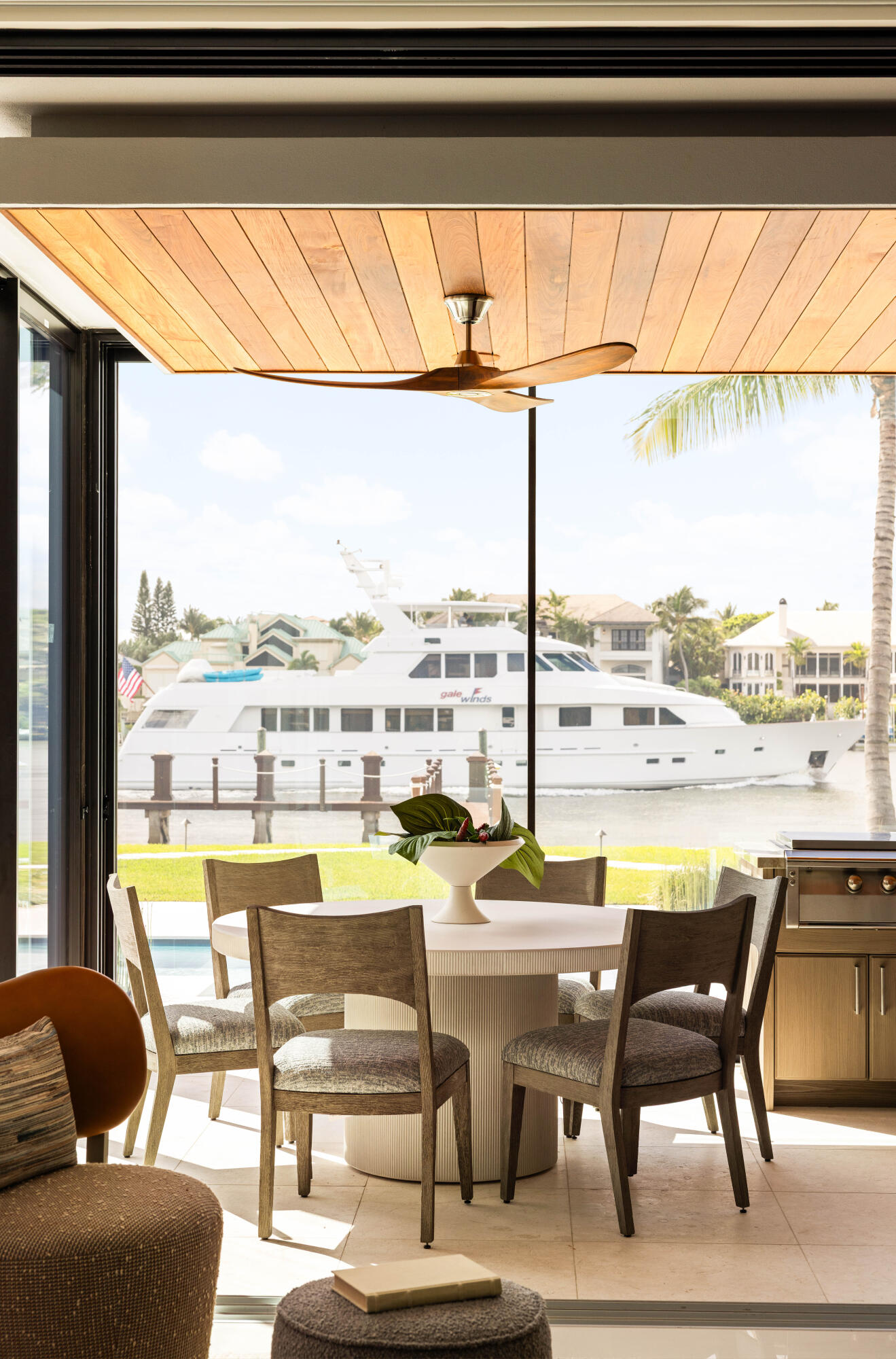 488 South Beach Road Jupiter Island, FL 33455 - Photo 12 of 54 a room with furniture a table and chairs next to a window