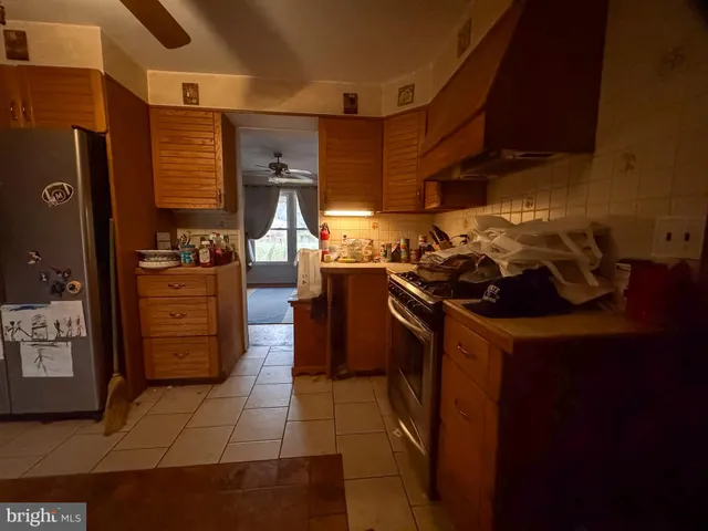 a kitchen with a stove and a refrigerator