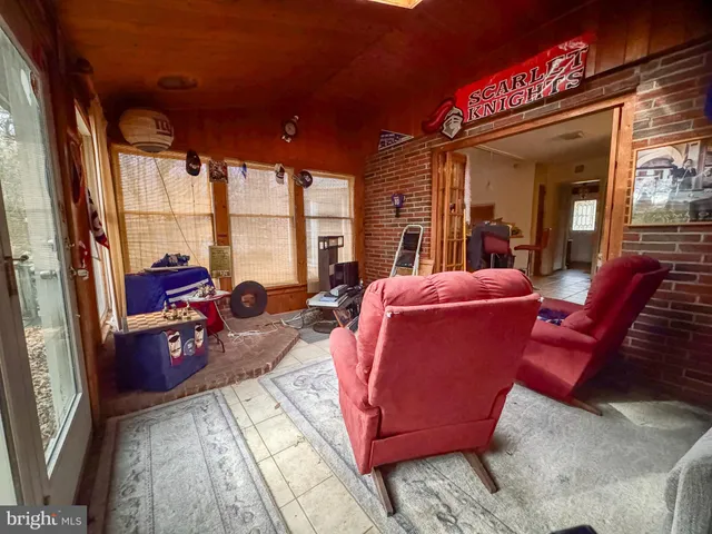 a living room with furniture fireplace and flat screen tv