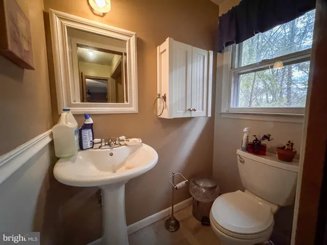 a view of a hallway with wooden shelves