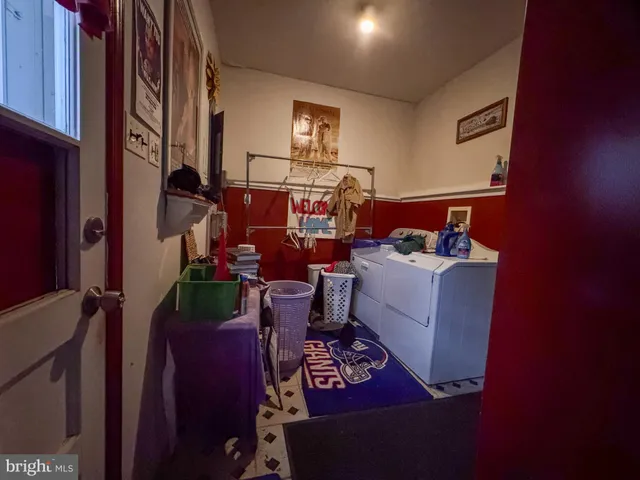 a very nice looking room with many windows and furniture