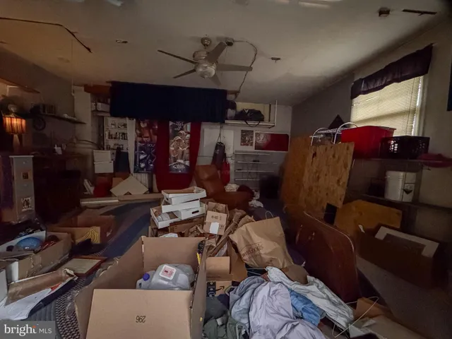 a living room with lots of furniture and a window