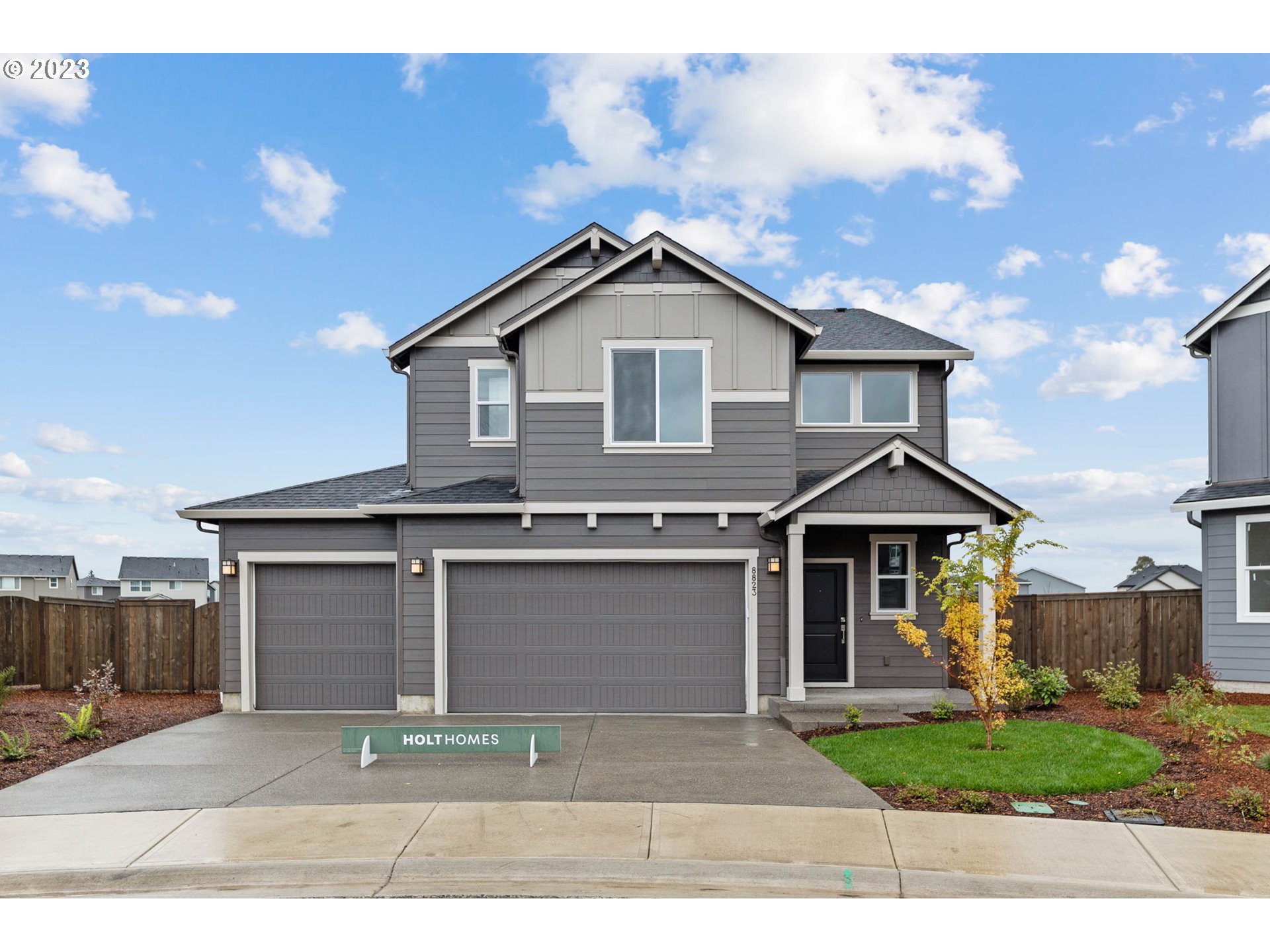 8823 North 3rd Circle Ridgefield, WA 98642 - Photo 1 of 41 a front view of a house with garden