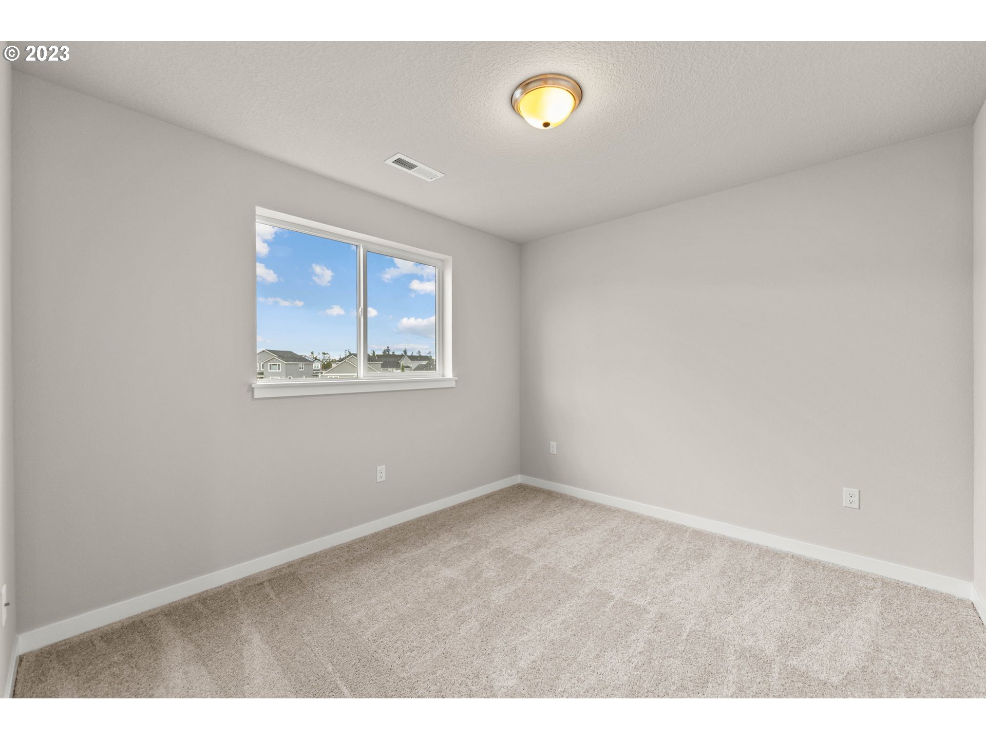 8823 North 3rd Circle Ridgefield, WA 98642 - Photo 23 of 41 a view of an empty room with a window