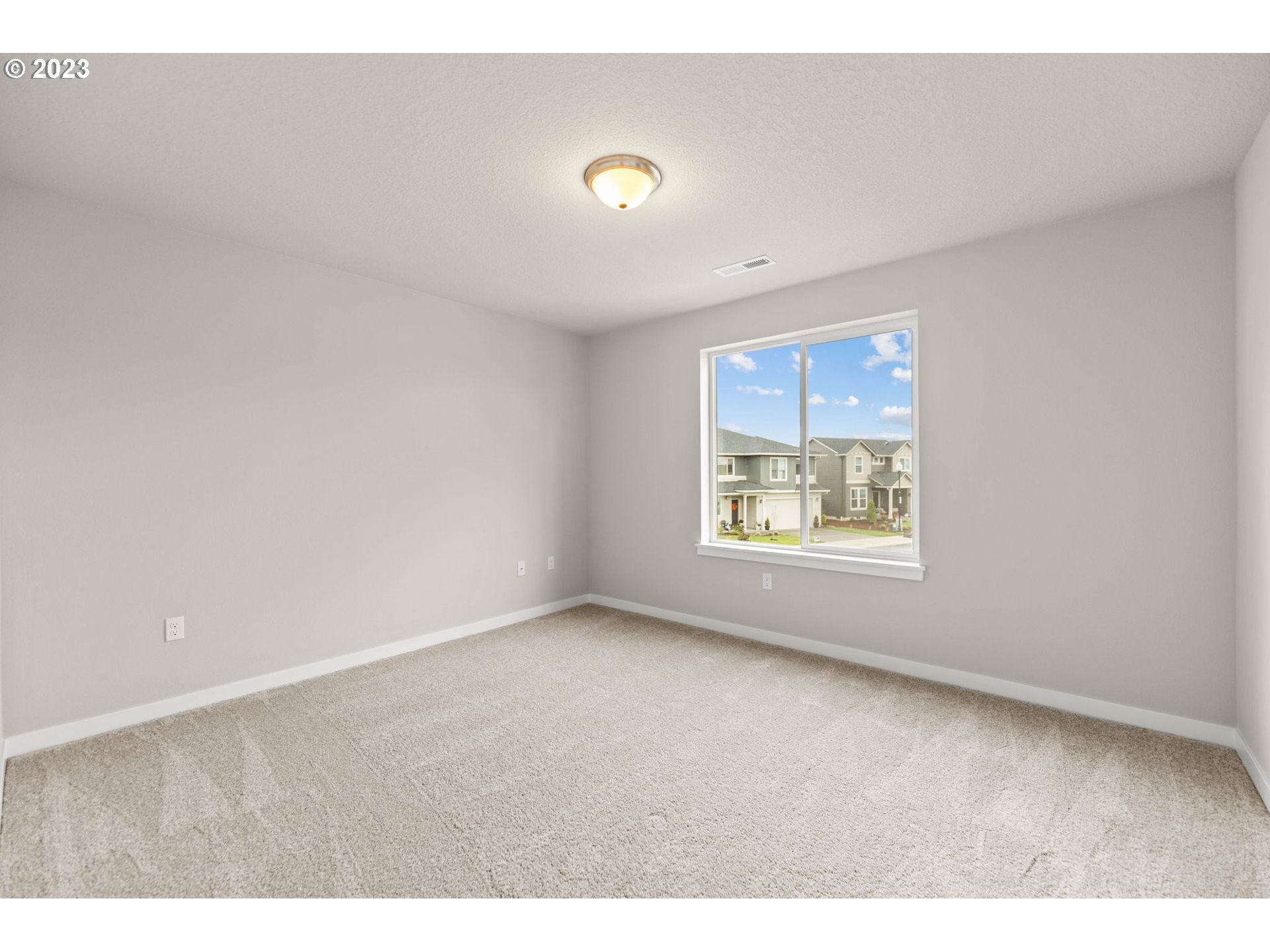 8823 North 3rd Circle Ridgefield, WA 98642 - Photo 33 of 41 a view of an empty room with a window