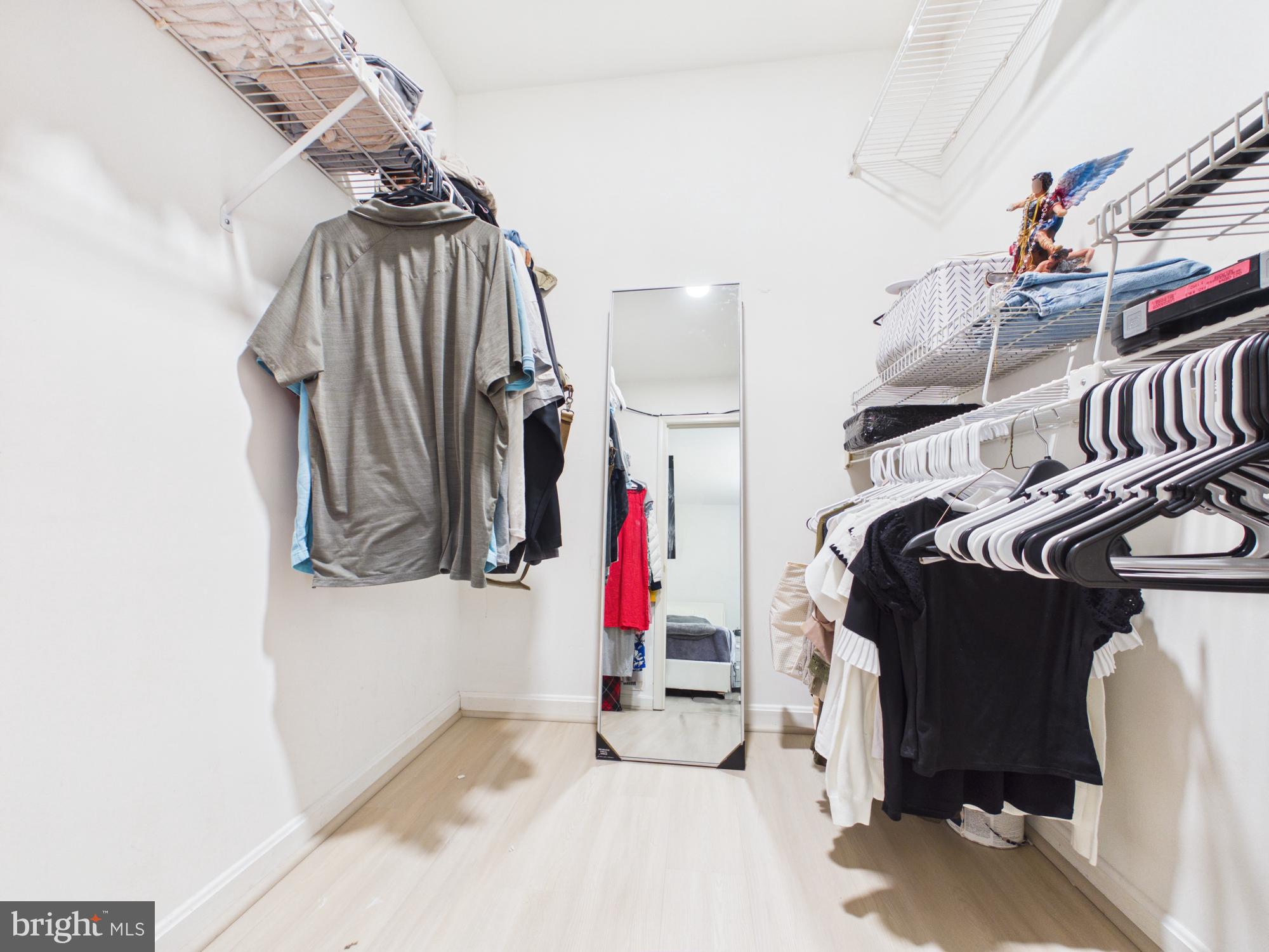 7606 Huntsman Court Clinton, MD 20735 - Photo 28 of 40 a view of walk in closet with clothes and shoes