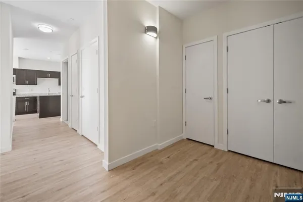 a view of a bathroom with wooden floor and a sink