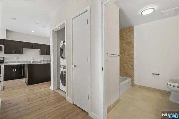 a kitchen with stainless steel appliances a refrigerator and a sink
