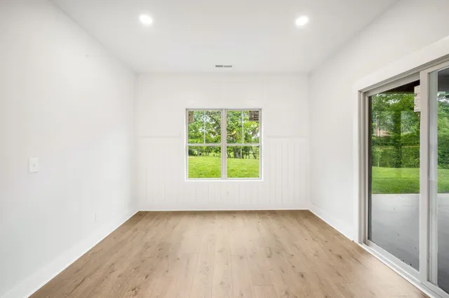 a view of storage and utility room with wooden floor
