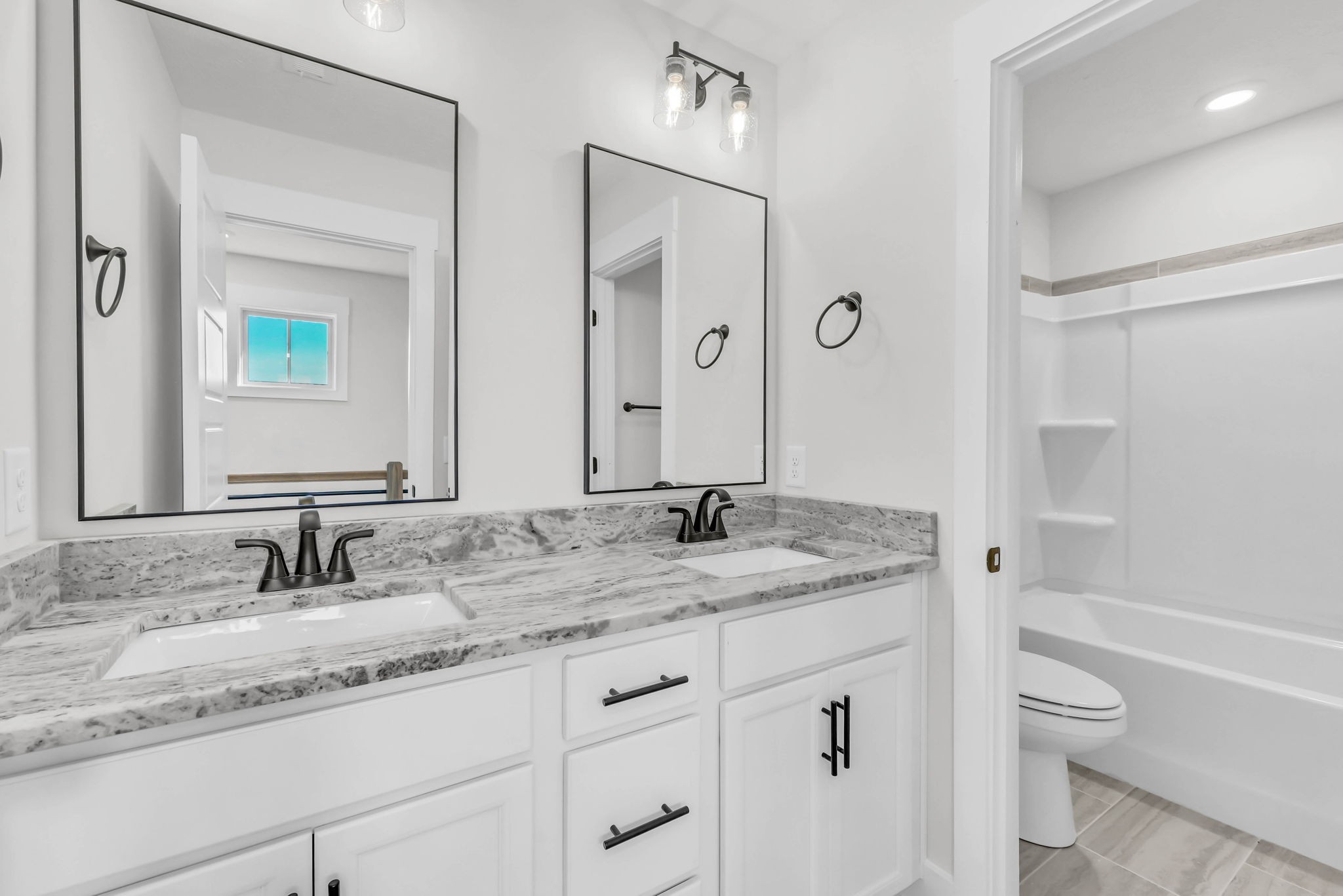 419 Blue Ridge Clarksville, TN 37043 - Photo 35 of 48 a bathroom with a granite countertop sink a toilet a mirror and shower