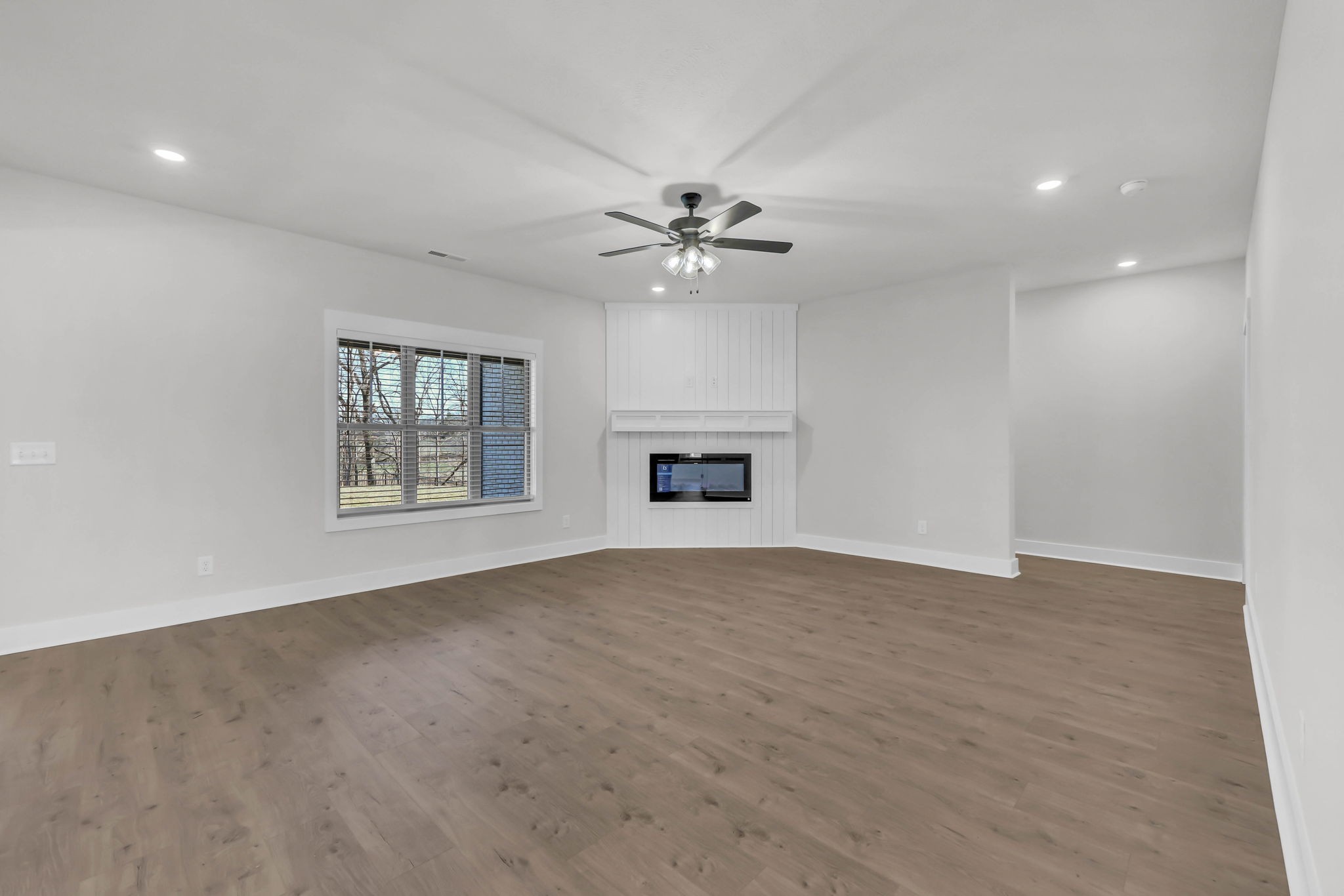419 Blue Ridge Clarksville, TN 37043 - Photo 10 of 48 an empty room with windows and a ceiling fan