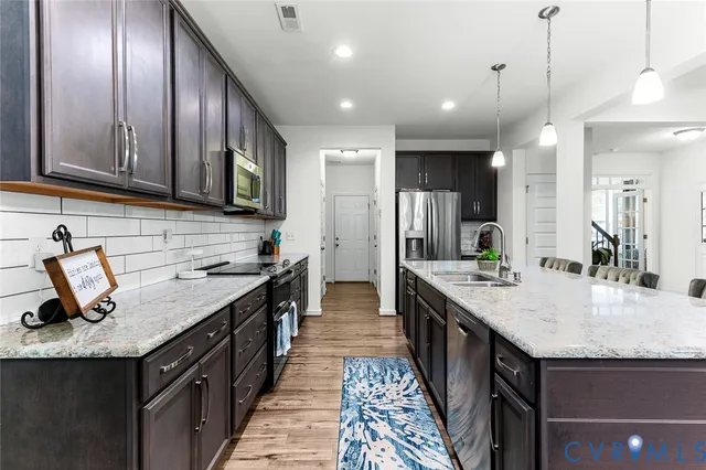 a view of a dining room with furniture large window and wooden floor