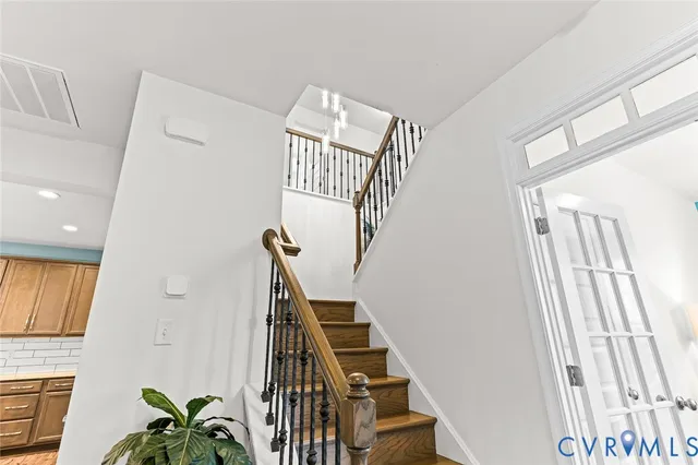 a view of a room with furniture and floor to ceiling window