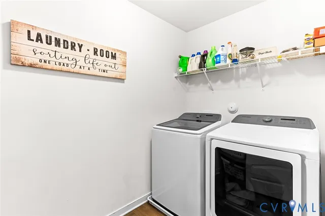 a bathroom with double sink and a mirror