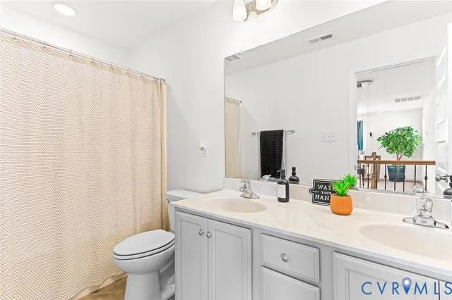 a living room with furniture gym equipment and a large window