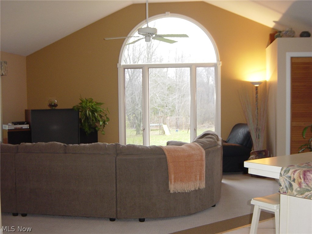 35650 Solon Road Solon, OH 44139 - Photo 4 of 14 A soaring vaulted family room is illumintaed by a bright palladium window to accentuate the open layout as well as the peace and serenity of the wooded setting.