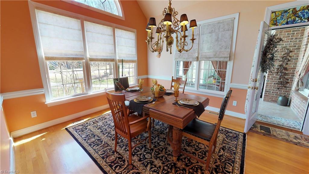 7857 Alcorn Road Oak Ridge, NC 27310 - Photo 13 of 28 Guest house Dining room and door to Sunroom.