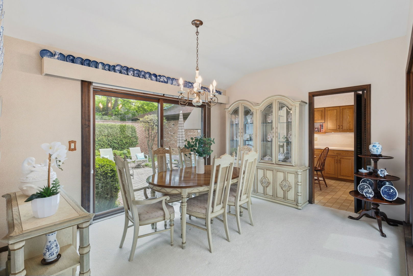 715 Tomlin Drive, Unit A1 Burr Ridge, IL 60527 - Photo 9 of 24 a view of a dining room with furniture window and outside view