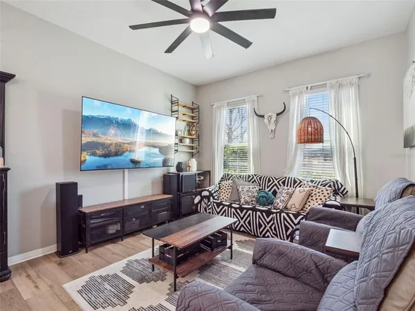 a living room with furniture and a window