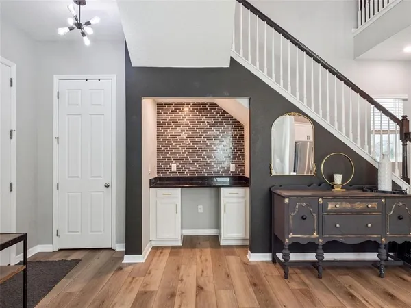 a view of a workspace with furniture and staircase