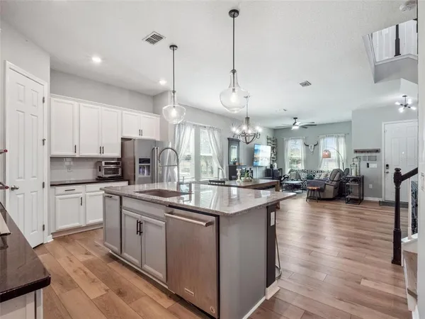 a kitchen with lots of counter top space and appliances