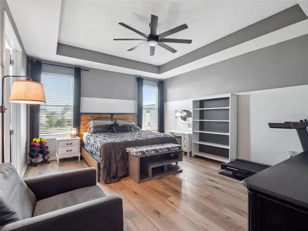 a bathroom with a granite countertop sink a mirror and shower