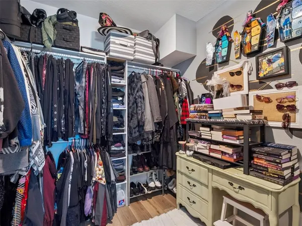 a bedroom with furniture and a window