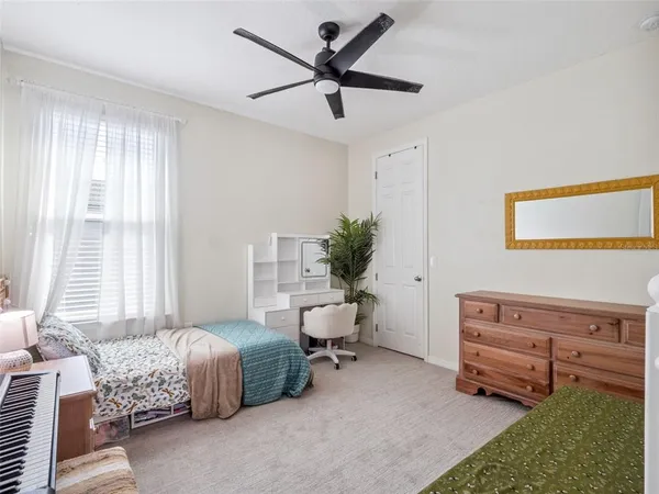 a living room with furniture windows and a flat screen tv