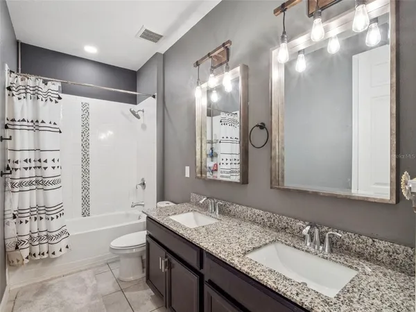 a view of a brick house with a street