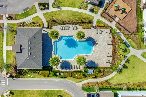 a view of a swimming pool and a chair