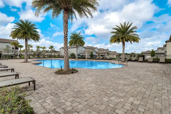 an aerial view of a swimming pool and outdoor space