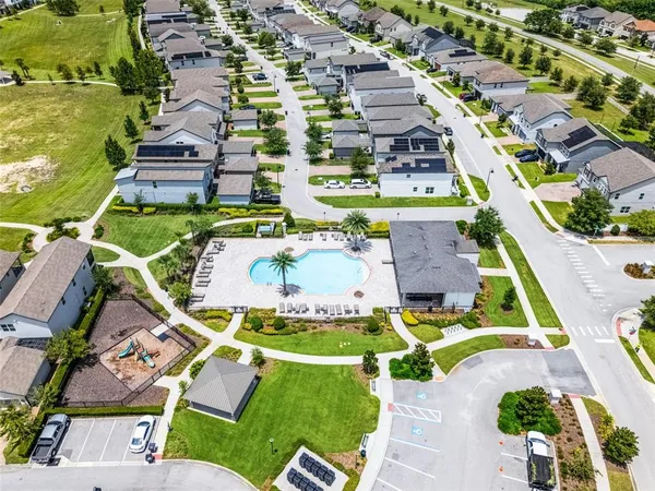 an aerial view of a house with a lake view