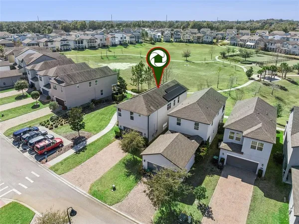 an aerial view of a house with a ocean view