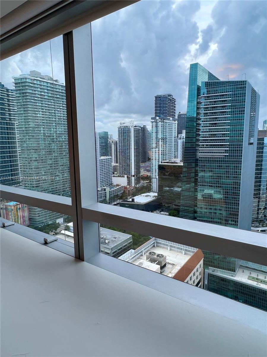 1435 Brickell Avenue, Unit 3307 Miami, FL 33131 - Photo 36 of 76 a view of a living room and a floor to ceiling window