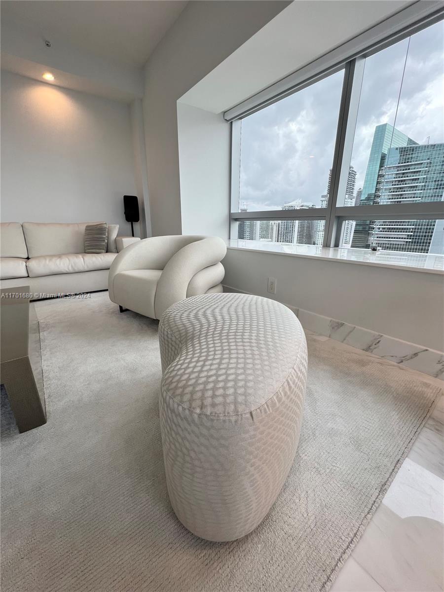 1435 Brickell Avenue, Unit 3307 Miami, FL 33131 - Photo 56 of 76 a living room with couches and balcony view